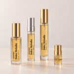 Dolce Melodia four decants including 2ml with transparent labels and gold and silver caps