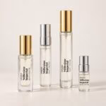 Four Creed Millesime Imperial decants with transparent labels and silver and gold caps