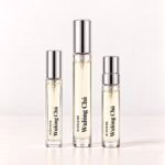 Nishane Wulóng Chá in three clear-labelled decants: a regular vial, slim rectangular premium 5 ml and round premium 10 ml.